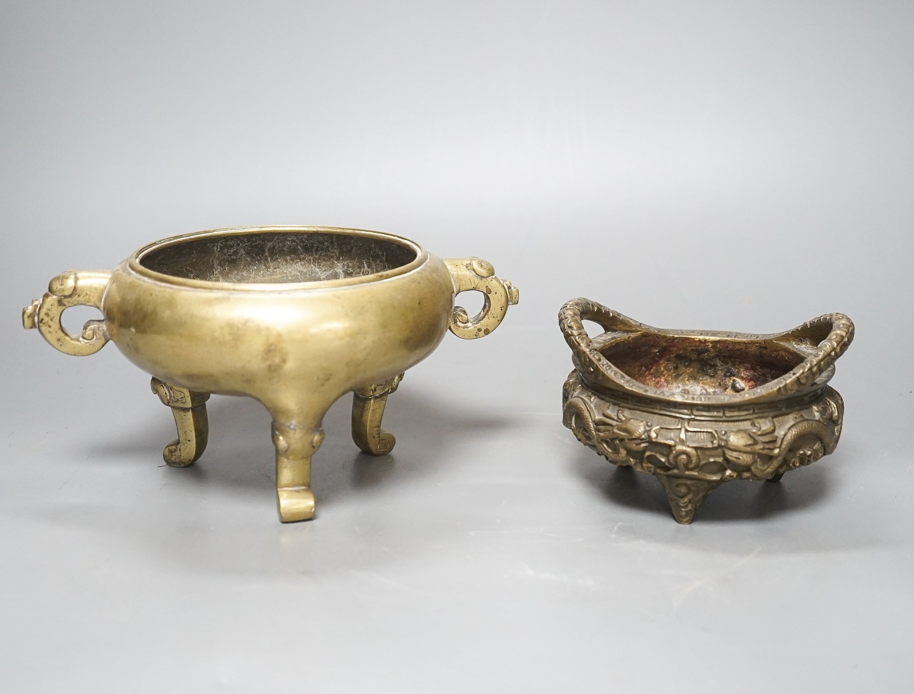 Two Chinese bronze tripod censers, Xuande marks but early 20th century, largest 21cm wide